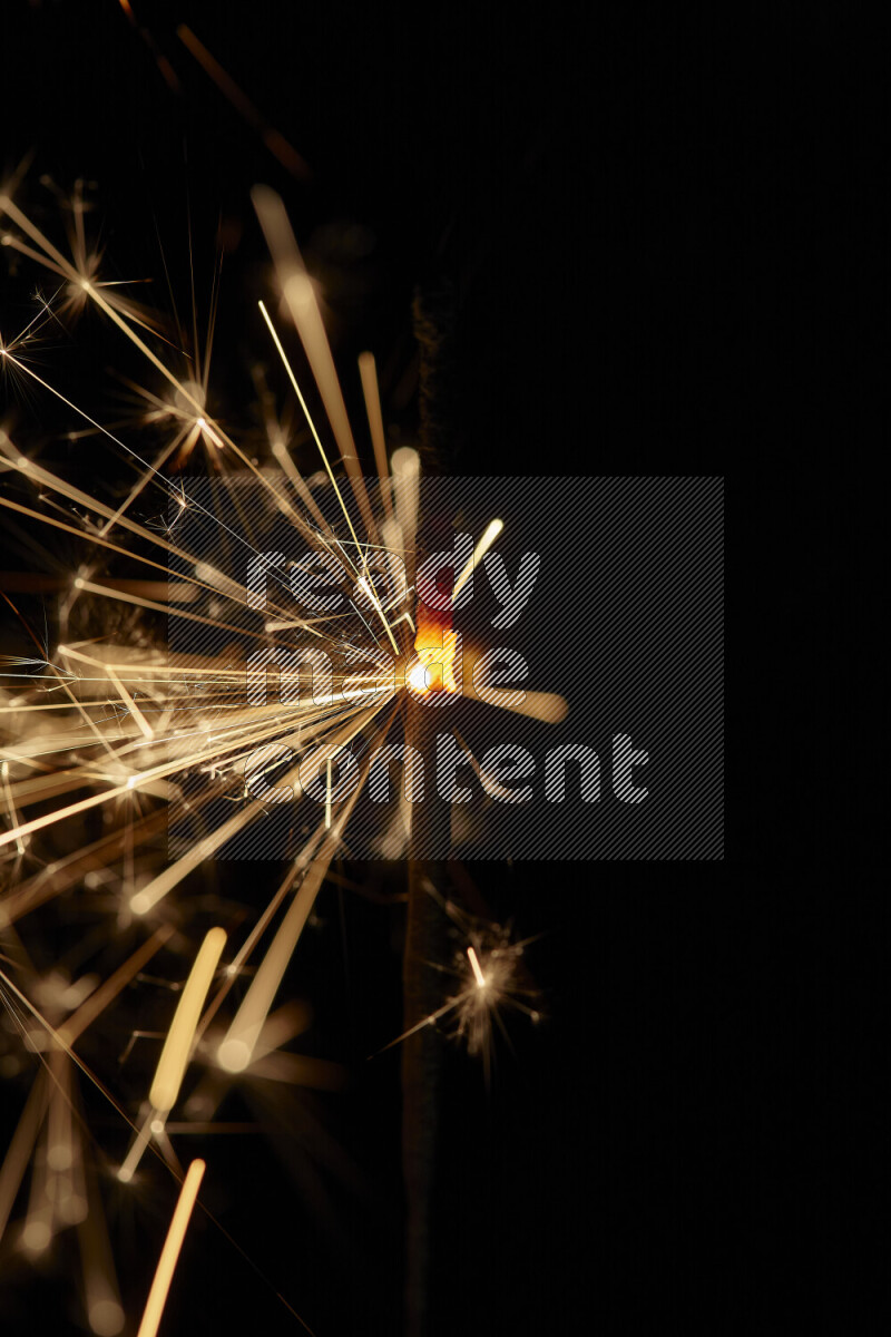 A close-up image of sparkler candle isolated on black background