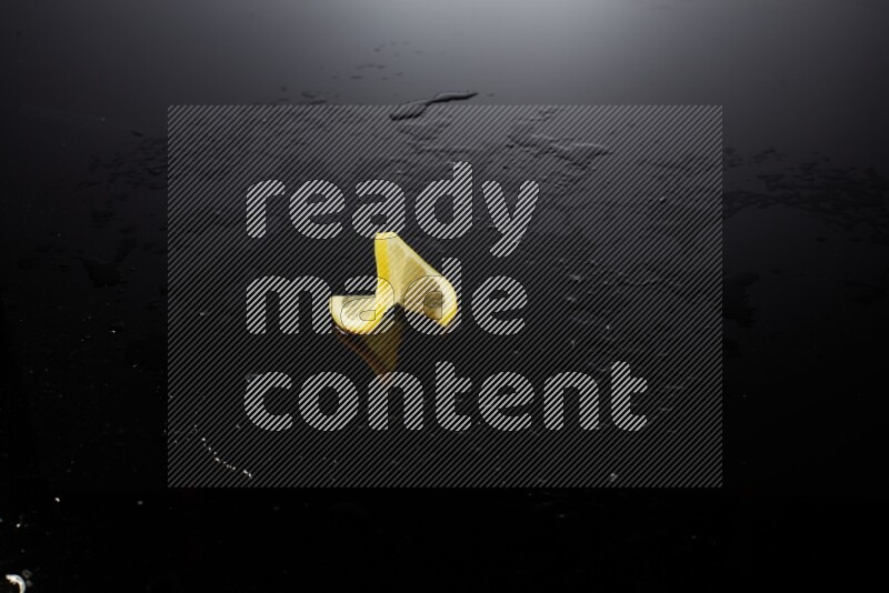 Lemon slice on black background