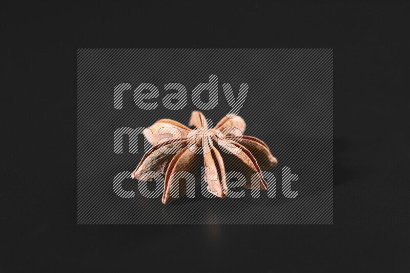 Star anise on black background