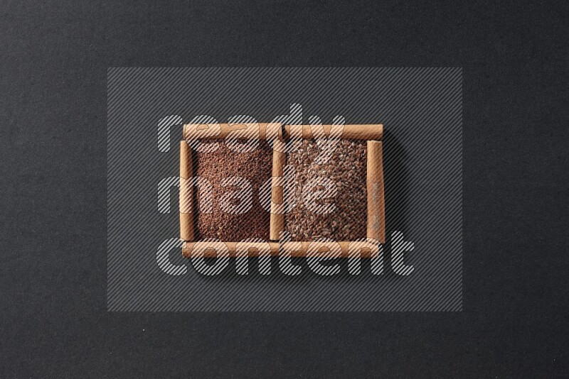 2 squares of cinnamon sticks full of garden cress and flaxseeds on black flooring
