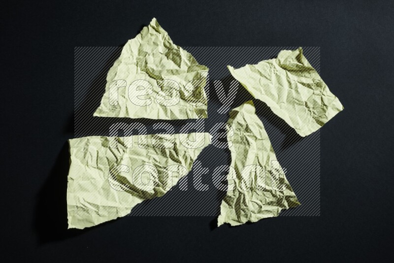 Yellow paper sheet on black background