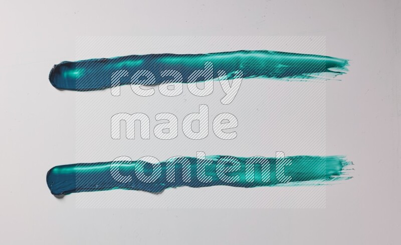 Turquoise painting knife strokes on white background