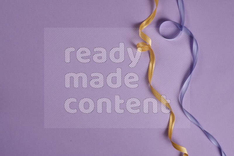 A yellow and purple collection of sewing and tailoring tools arranged on a purple background