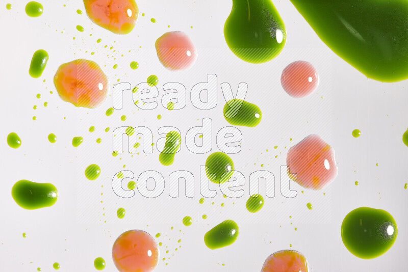 Close-ups of abstract red and green paint droplets on the surface