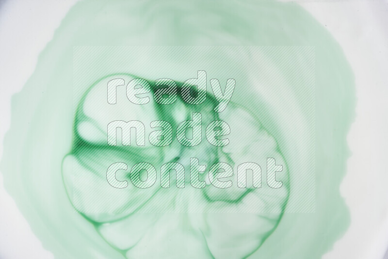 A close-up of abstract swirling patterns in green gradients