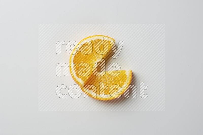 Two halves of an orange slices on white background
