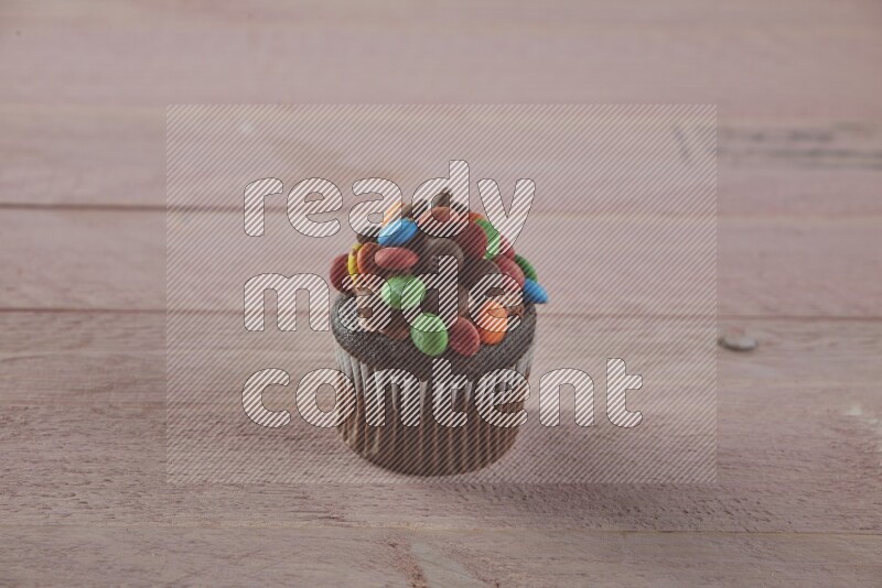 Chocolate mini cupcake topped with m&ms
