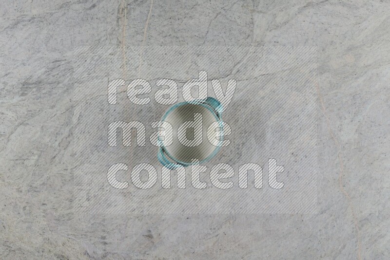 A multicolored pottery Bowl on grey marble background