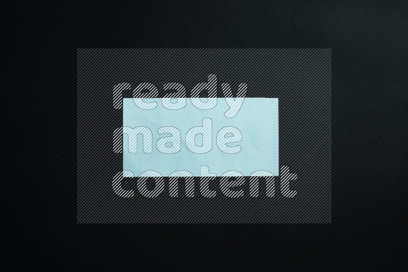 Blue paper sheet on black background