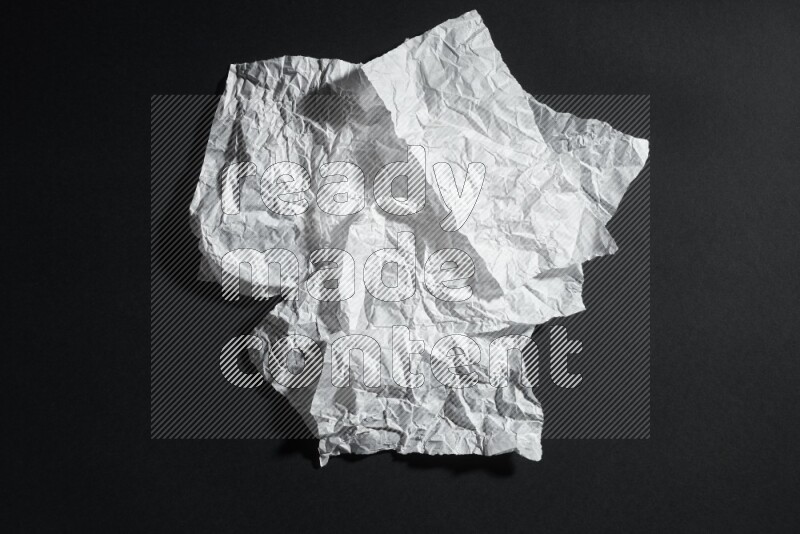 White paper sheet on black background