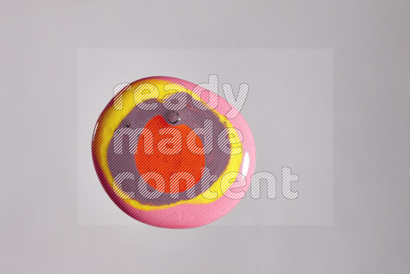 Close-ups of assorted colors blending on a grey background