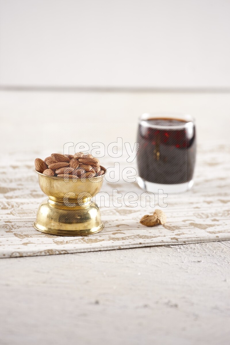 Nuts in a metal bowl with tamarind in a light setup