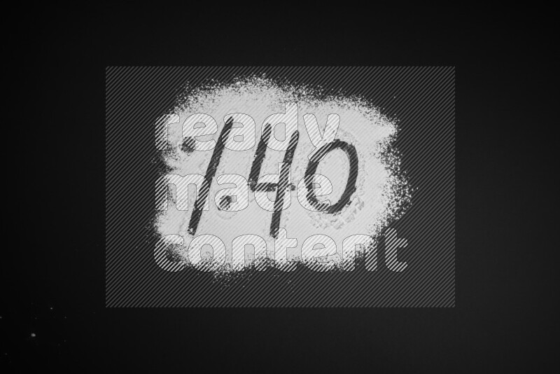 Percentages written with powder on black background