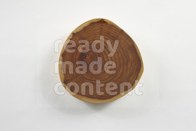 A circular wooden slab with natural textures on white background
