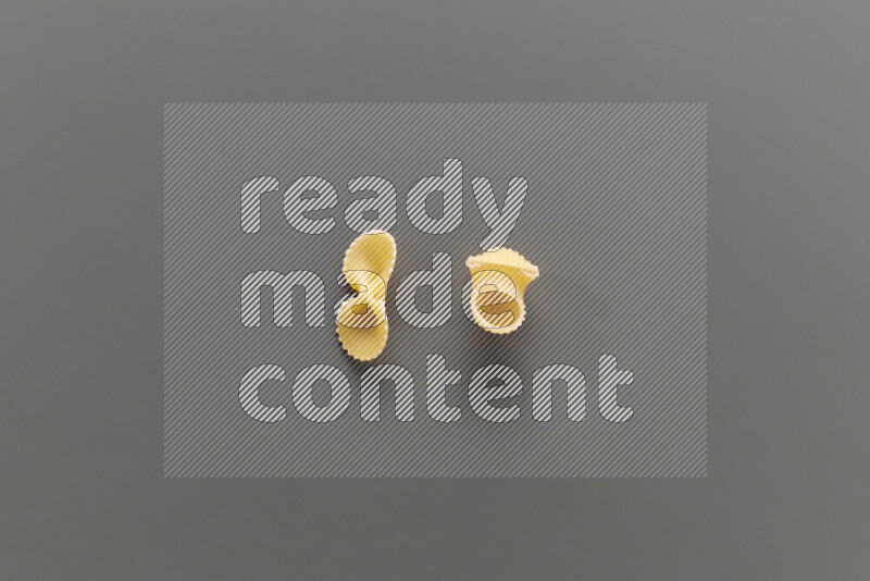 Fiocchi pasta with other types of pasta on grey background