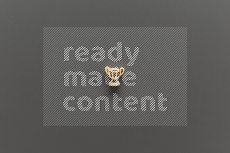 Shaped children pasta on grey background