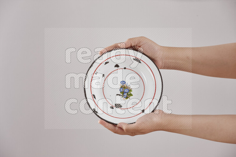 Woman hands holding different metal essentials in different positions