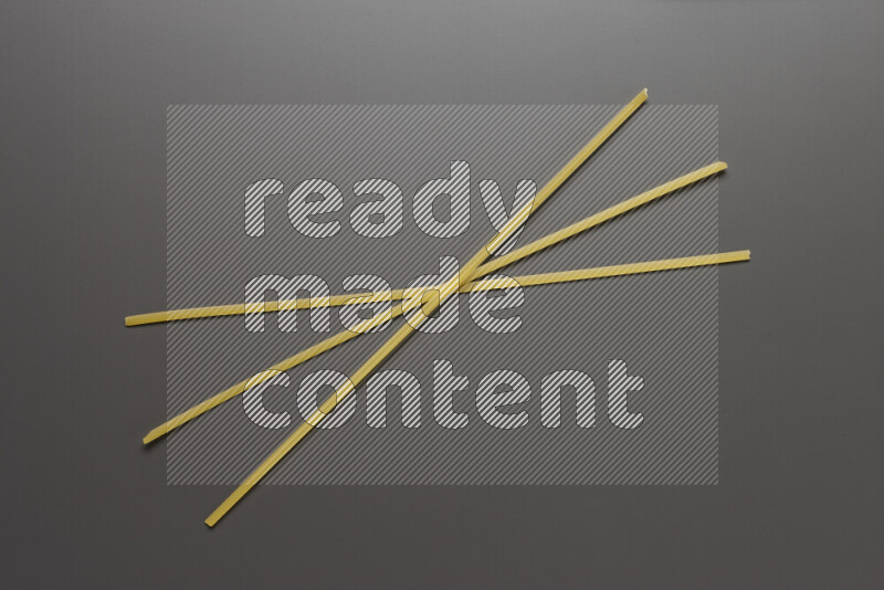 Linguini pasta on grey background