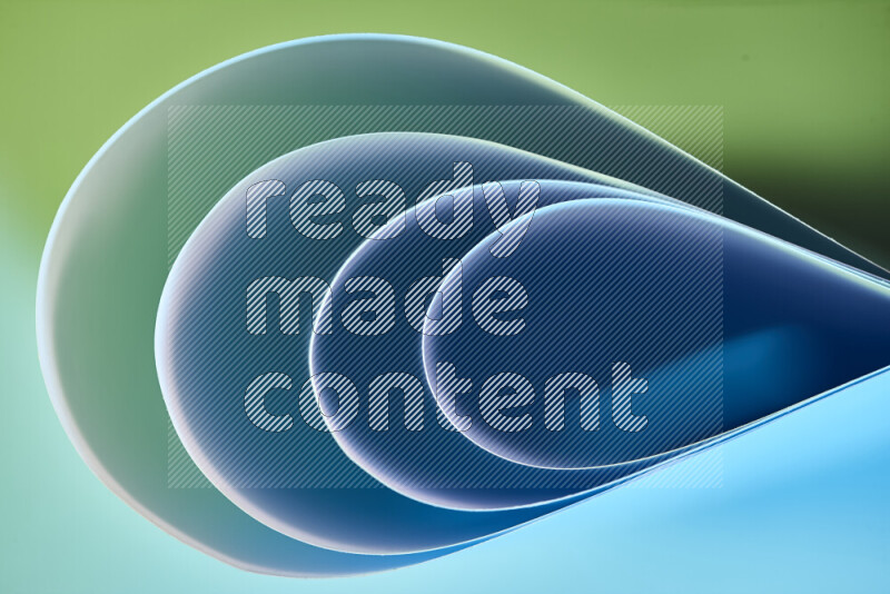 An abstract art of paper folded into smooth curves in green and blue gradients