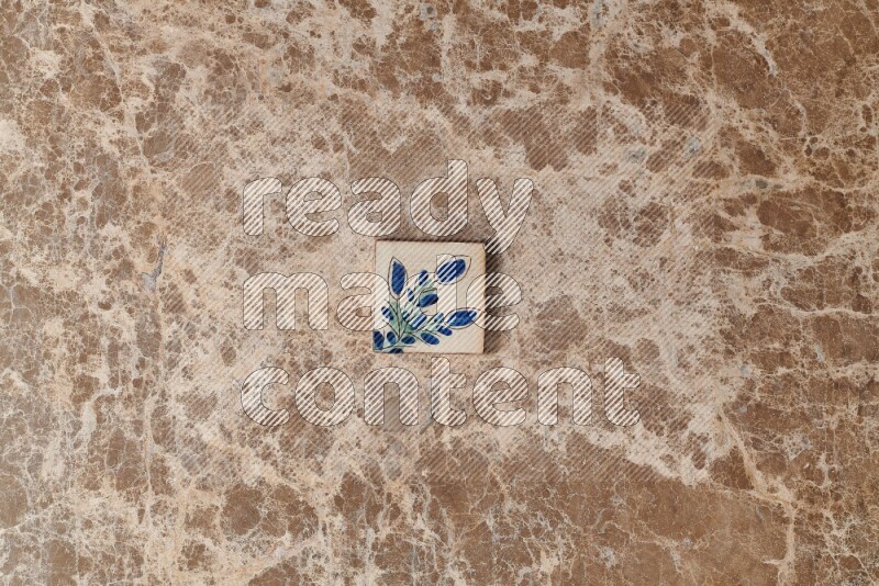 A decorative coaster on beige marble background