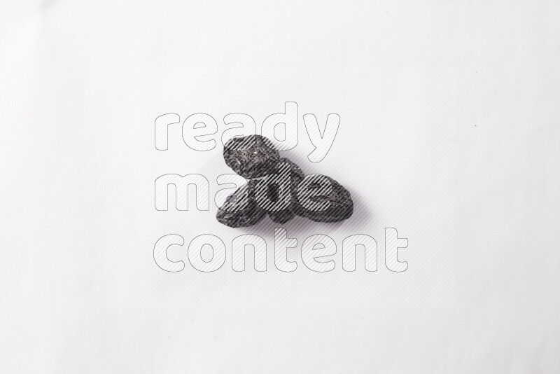 Dried plums on white background