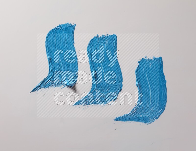 Multi blue curved brush strokes shaped into different shapes on a white background