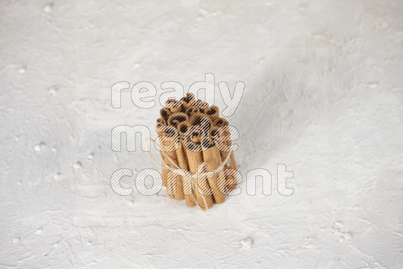 A bounded stack of cinnamon sticks on white background