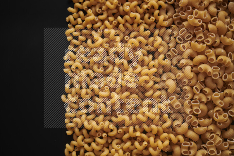 Different pasta types on black background