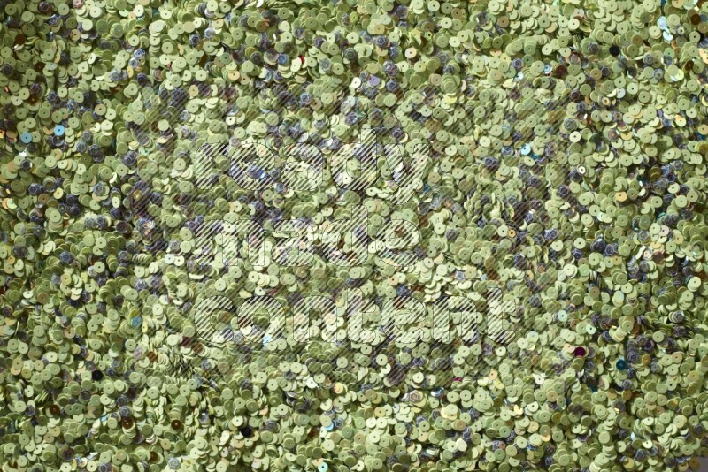 Multicolored flat sequins on grey background