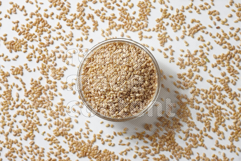 Hulled wheat on white background