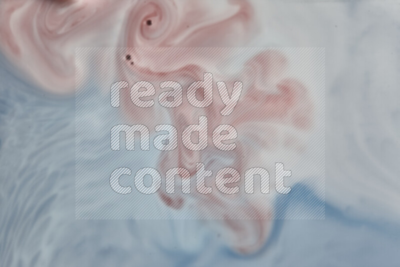 A close-up of abstract swirling patterns in blue, red and white