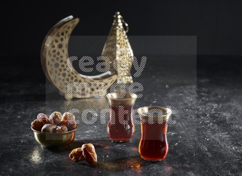 Dates with hot drinks and golden lanterns in a dark setup
