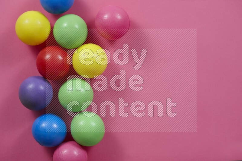Multicolored plastic balls on different colored backgrounds (kids toys)