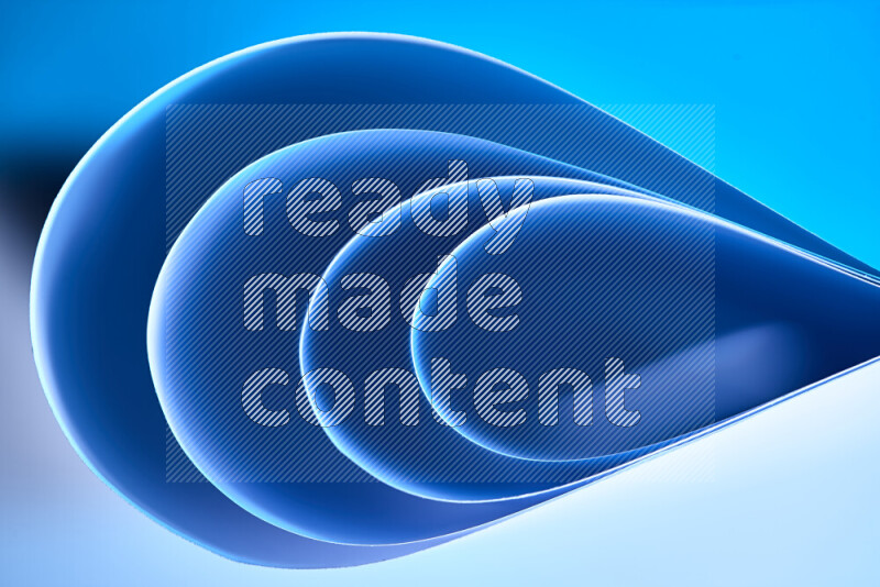 فن تجريدي لورق مطوي على شكل منحنيات ناعمة بتدرجات اللون الأزرق