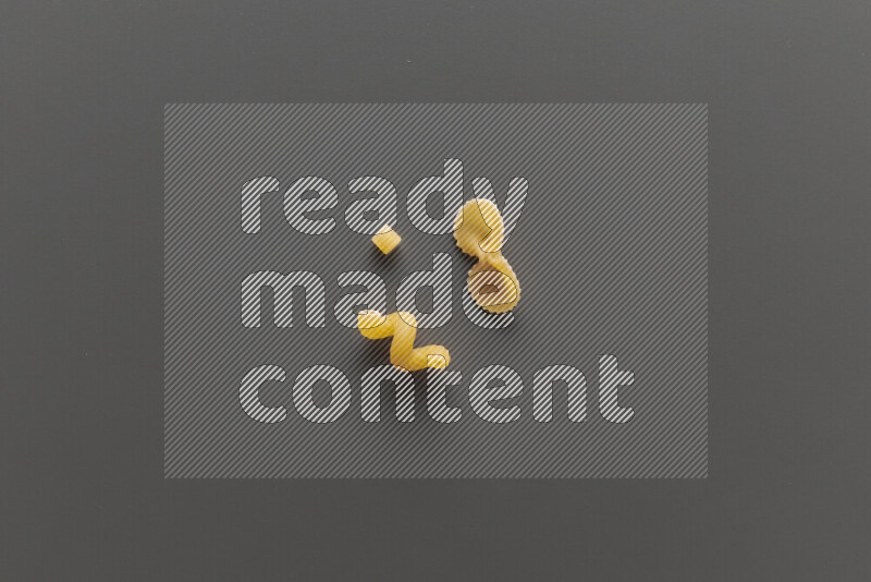 Different pasta types on grey background