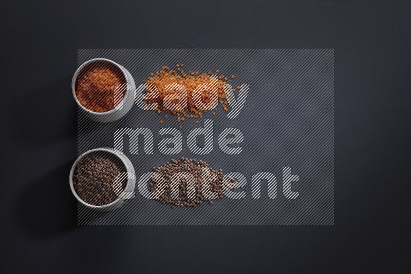 Legumes in pottery bowls on grey background