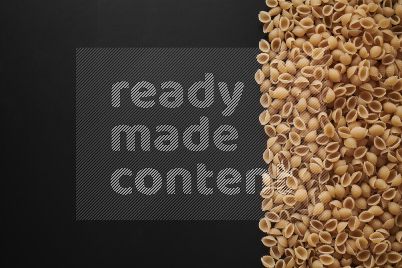 Different pasta types on black background