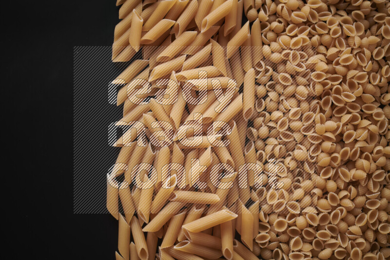 Different pasta types on black background