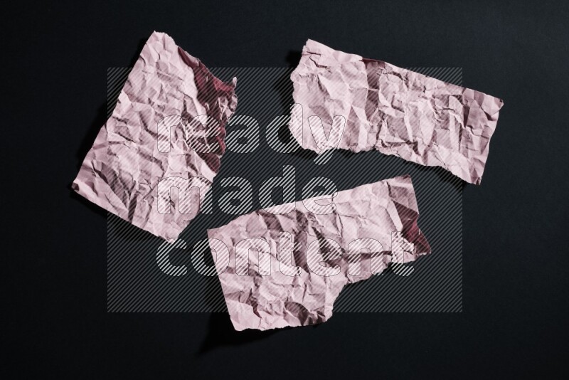 Pink paper sheet on black background