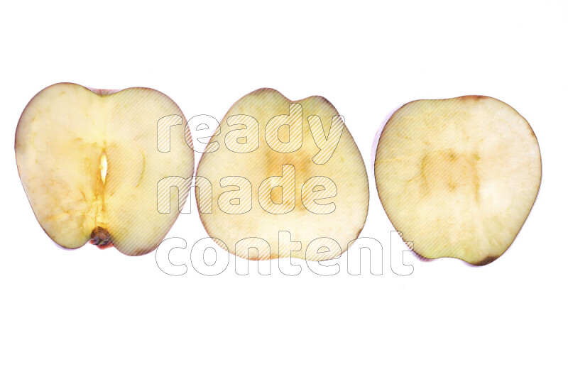 Apple slices on illuminated white background
