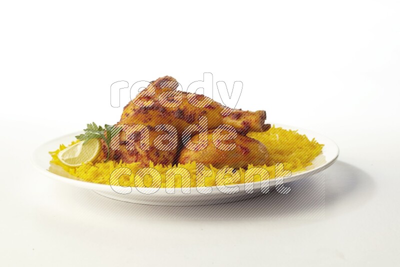 yellow basmati Rice with kabsa chicken pieces on a white rounded plate direct on white background