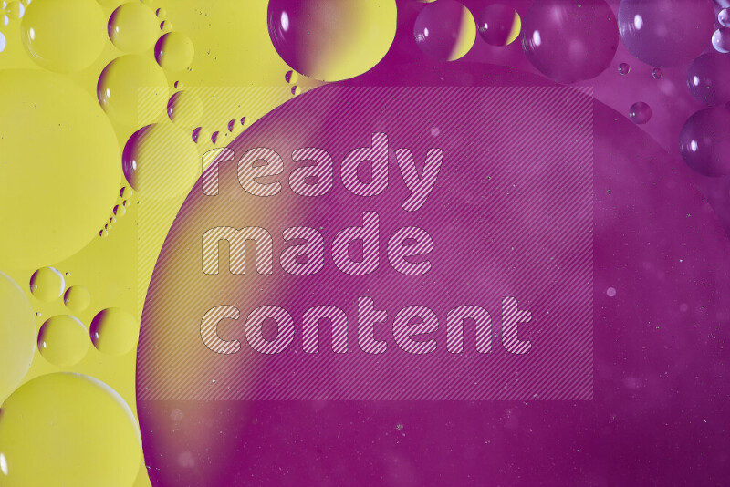 Close-ups of abstract oil bubbles on water surface in shades of yellow and pink