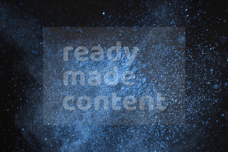 Blue powder explosion on black background