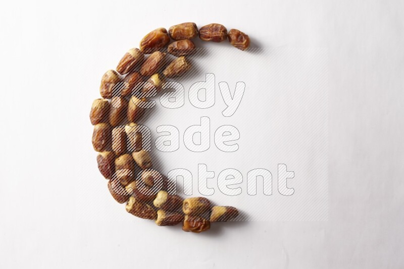 Dates in a crescent shape on white background