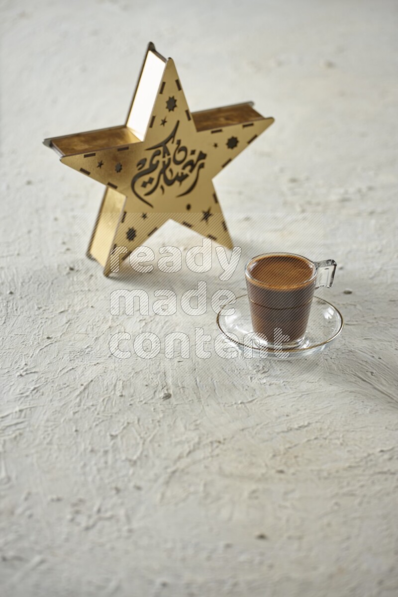 A wooden golden star lantern with different drinks, dates, nuts, prayer beads and quran on textured white background