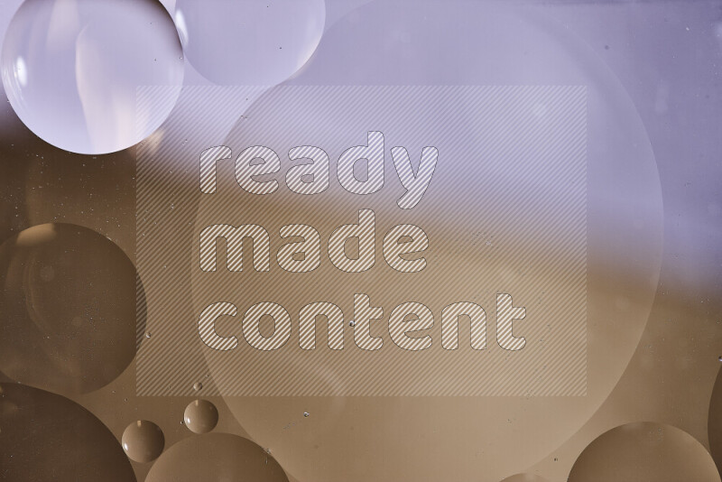 Close-ups of abstract oil bubbles on water surface in shades of white and brown