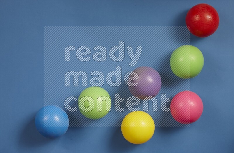 Multicolored plastic balls on different colored backgrounds (kids toys)