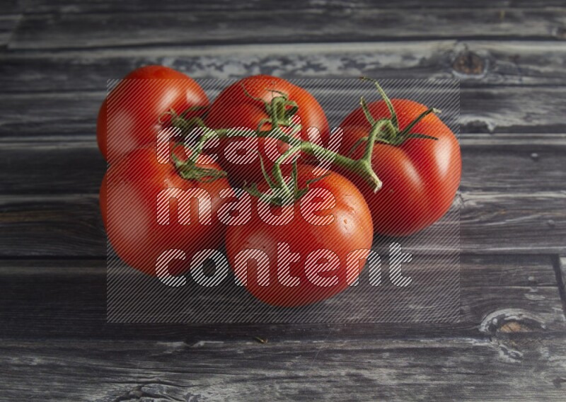 45 degree vein of roma tomato tomato on a textured grey wooden background