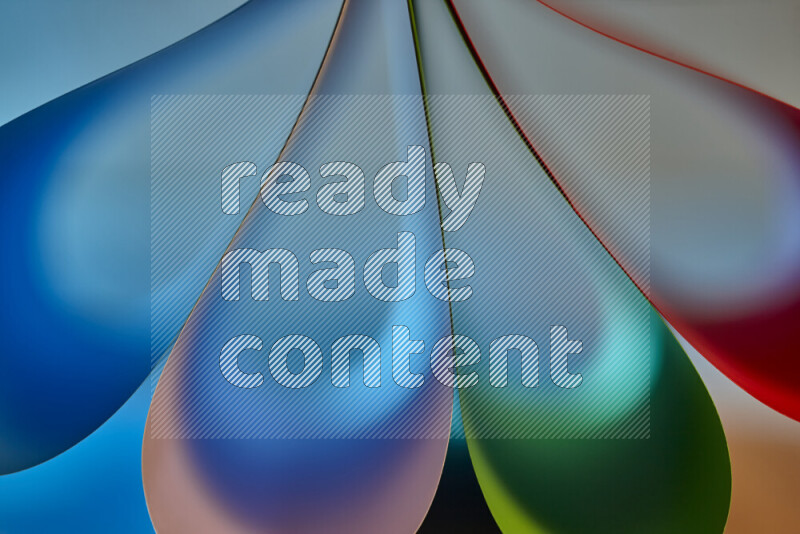 An abstract art piece displaying smooth curves in colorful gradients created by colored light