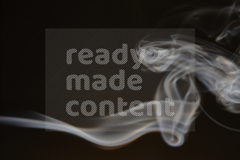 Motion of wavy smoke isolated on dark background